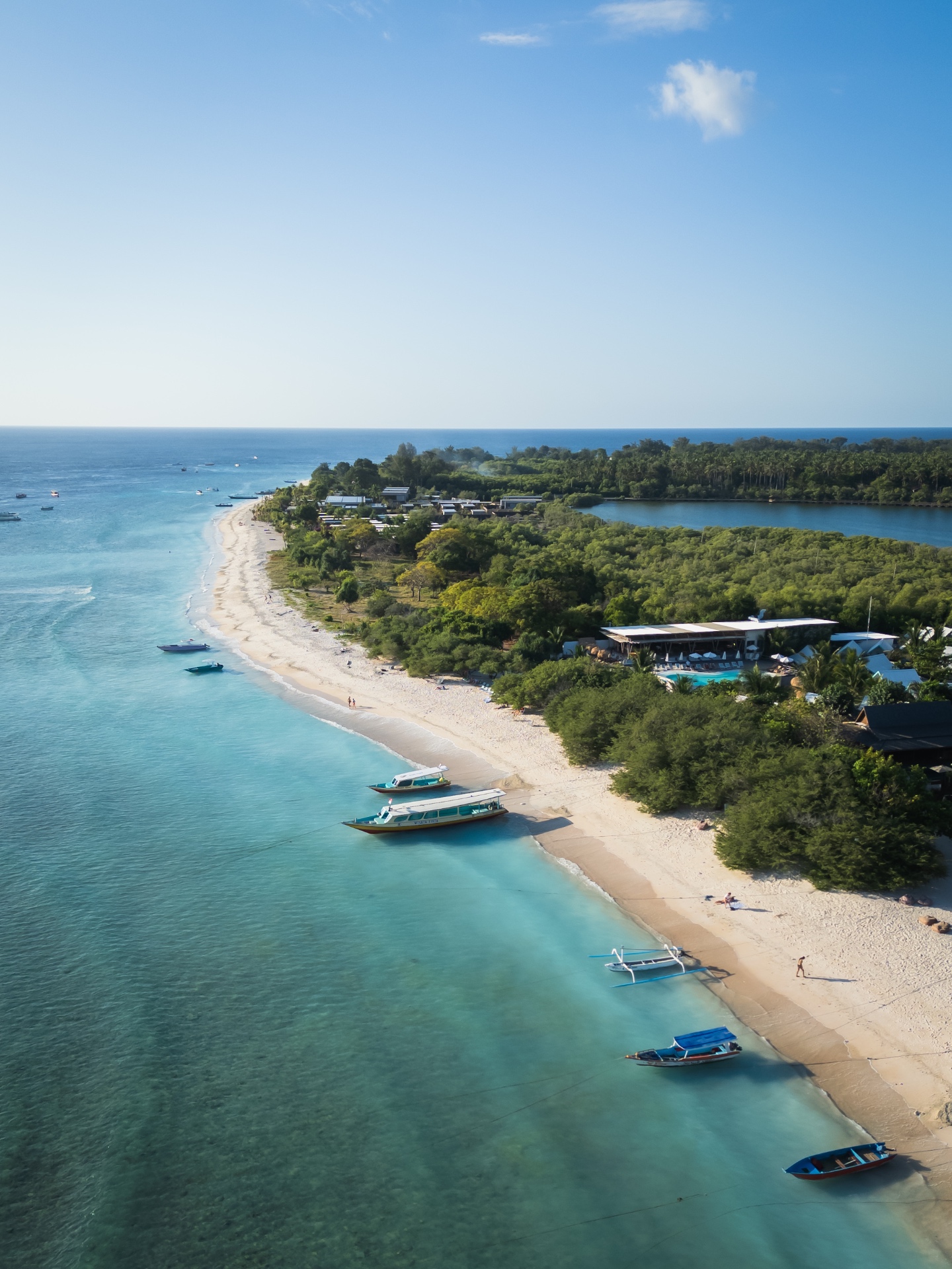 Tropical beach with boats and turquoise water